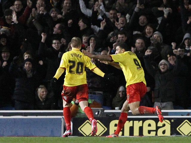 Matej Vydra is congratulated by team mate Troy Deeney after scoring his team's second goal on December 29, 2012