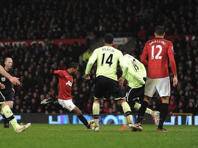 United defender Patrice Evra scores the second goal for his team against Newcastle on December 26, 2012