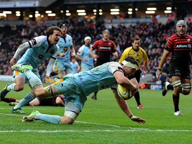 Northampton Saints' Phil Dowson scores the first try against Saracens on December 30, 2012