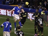 Everton defender Phil Jagielka heads home his team's second against Wigan on Boxing Day 2012