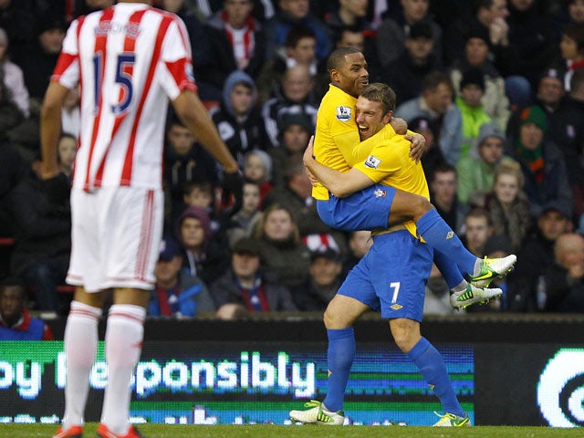 Rickie Lambert is congratulated by Jason Puncheon after scoring the opener against Stoke on December 29, 2012