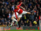 Shane Long and Chris Smalling battle for the ball on December 29, 2012