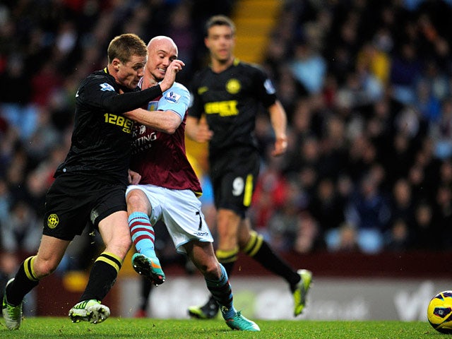 Aston Villa's Stephen Ireland and Wigan's James McCarthy battle for the ball on December 29, 2012