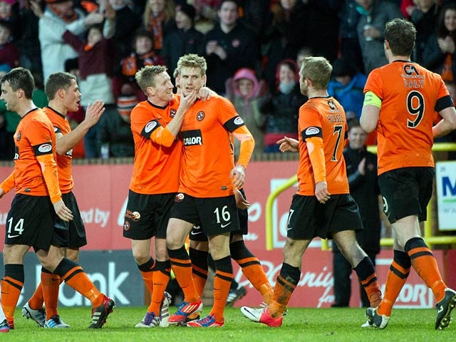 Dundee United's Stuart Armstrong is celebrates with his team mates after scoring against St Mirren on December 30, 2012