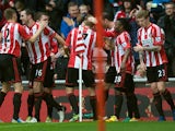 John O'Shea is congratulated by team mates after scoring the opener on December 29, 2012
