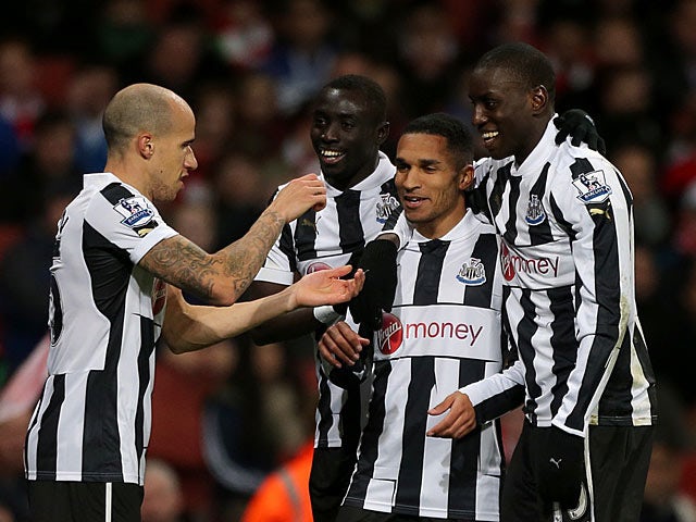 Sylvain Marveaux is congratulated by team mates after scoring his team's second goal against Arsenal on December 29, 2012