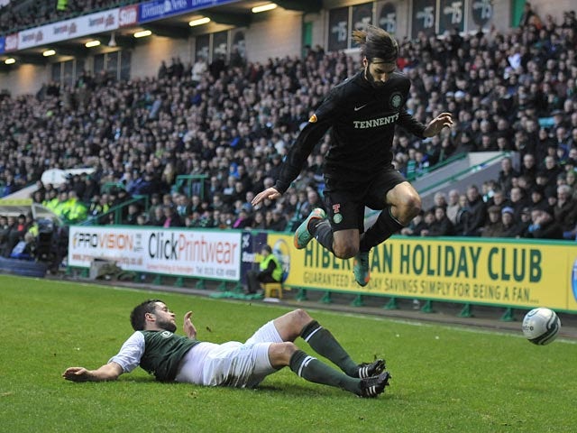 Hibernian's Tim Clancy slides in to win the ball from Celtic's Georgios Samaras on December 29, 2012