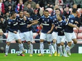 Aaron Lennon is congratulated by team mates after scoring the winning goal against Sunderland on December 29, 2012