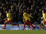 Watford's Troy Deeney is chased down by team mates after scoring the opener against Brighton on December 29, 2012