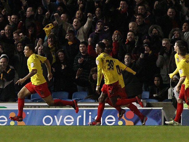Watford's Troy Deeney is chased down by team mates after scoring the opener against Brighton on December 29, 2012