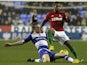 Swansea winger Wayne Routledge is tackled by Reading's Alex Pearce during the match on December 26, 2012