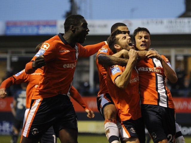 Luton players celebrate Alex Lawless' opener against Wolves in Round 3 on January 5, 2013