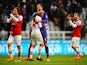 Arsenal players celebrate their win over Newcastle after the final whistle of their Premier League match on December 29, 2013
