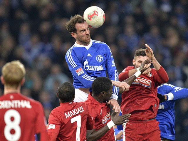 Schalke's Christoph Metzelder heads the ball on December 15, 2012