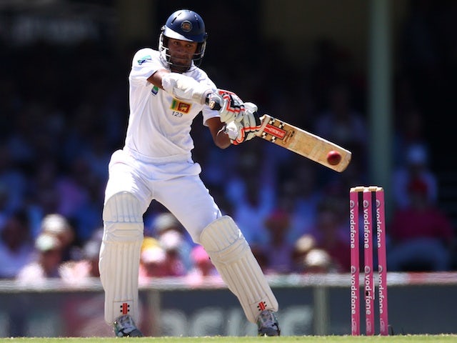 Sri Lanka's Dimuth Karunaratne cuts the ball against Australia on January 5, 2013