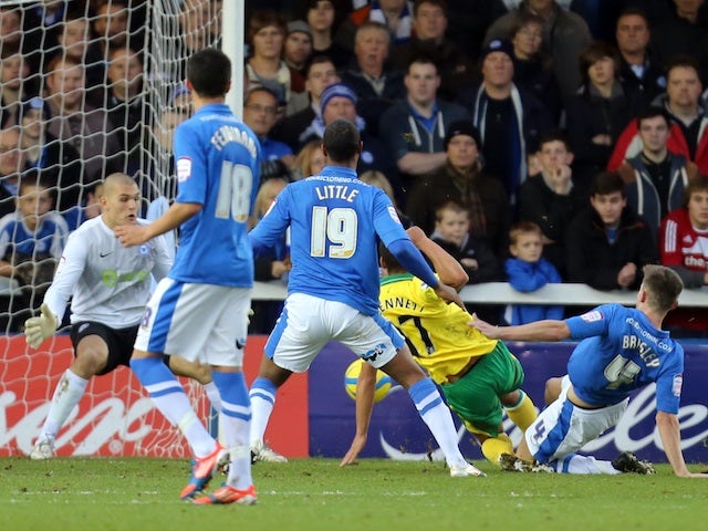 Norwich midfielder Elliott Bennett scores the first goal against Peterborough United on January 5, 2013