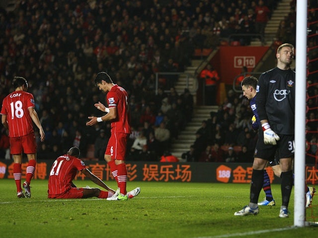 Saints players look dejected following an own goal by Guly Do Prado in the match against Arsenal on January 1, 2013