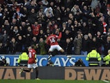 Man Utd forward Javier Hernandez celebrates his opener against Wigan on January 1, 2013