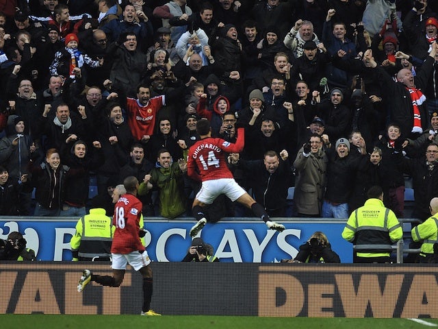 Man Utd forward Javier Hernandez celebrates his opener against Wigan on January 1, 2013