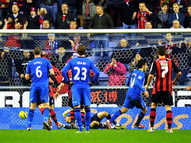 Wigan's Jordi Gomez misses a penalty but slots home the rebound against Bournemouth on January 5, 2013