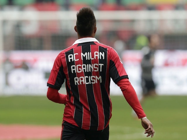 Milan midfielder Kevin Prince-Boateng sports an anti-racism shirt ahead of the game with Siena on January 6, 2013