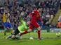 Mansfield players protest Luis Suarez's controversial goal for Liverpool on January 6, 2013