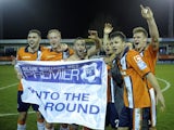 Players of non-league Luton Town celebrate knocking Championship side Wolves out of the FA Cup on January 5, 2013