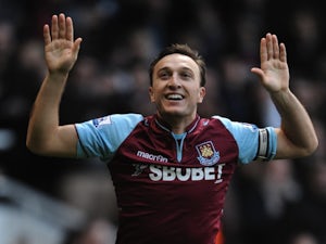 West Ham skipper Mark Noble celebrates his first minute penalty against Norwich on January 1, 2013