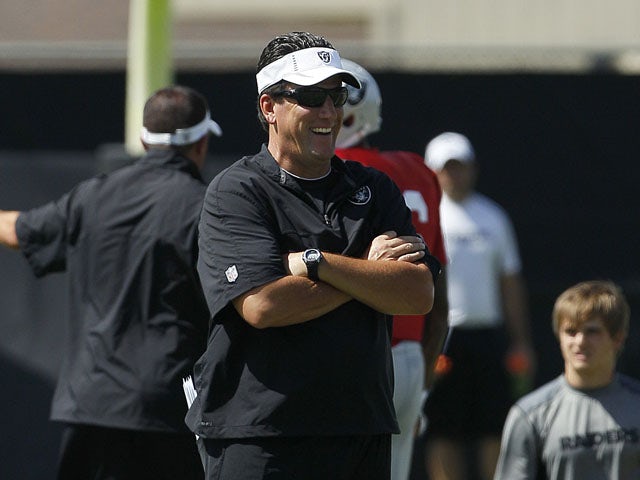 Greg Knapp of the Oakland Raiders watches a practice session on August 3, 2012