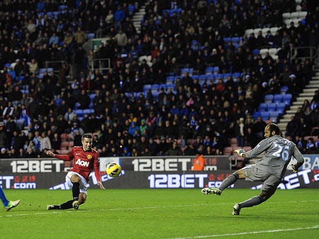 Robin Van Persie scores United's fourth against Wigan on January 1, 2013