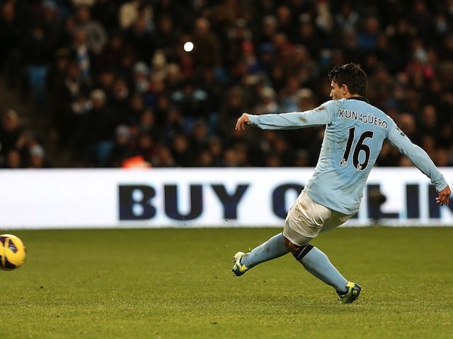 Man City striker Sergio Aguero scores a penalty against Stoke on January 1, 2013
