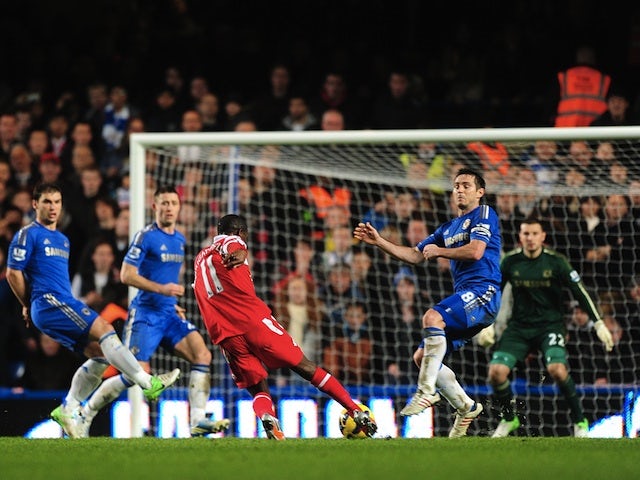 QPR's Shaun Wright-Phillips drives a shot into the bottom corner to open the scoring against Chelsea on January 2, 2013