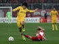 Taison of Metalist Kharkiv is challenged during their Europa League second leg tie on March 15, 2012