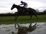 A waterlogged race track being ridden over by Pardini on December 11, 2006