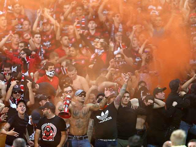 Western Sydney Wanderers fans let off flares during the A-League match against Melbourne Victory on December 28, 2013
