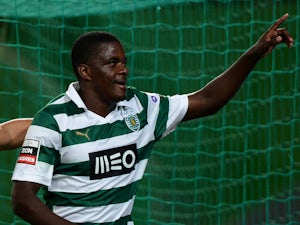 Sporting's midfielder William Carvalho celebrates after scoring a goal during the Portuguese football match Sporting CP vs FC Pacos de Ferreira on December 1, 2013