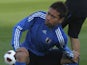 Japan's Yuto Nagamoto stretches during a training session in Qatar on January 6, 2011