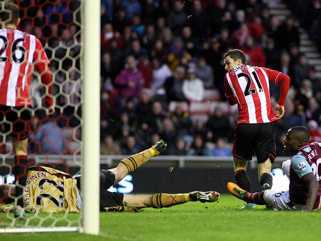 Adam Johnson scores his team's second goal against West Ham on January 12, 2013