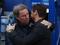 Spurs boss AVB embraces ex-Tottenham manager Harry Redknapp before the game between Spurs and QPR on January 12, 2013