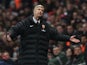 Arsenal boss Arsene Wenger stands dejected after the sending off of Laurent Koscielny against Man City on January 13, 2013