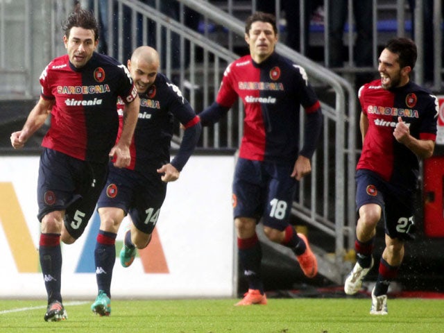 Daniele Conti celebrates scoring Cagliari's second goal in their Serie A match against Genoa on January 13, 2013
