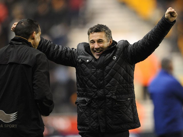 New Wolverhampton Wanderers manager Dean Saunders celebrates his teams equaliser against Blackburn Rovers on January 11, 2013