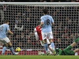 City forward Edin Dzeko taps in the second goal against Arsenal on January 13, 2013