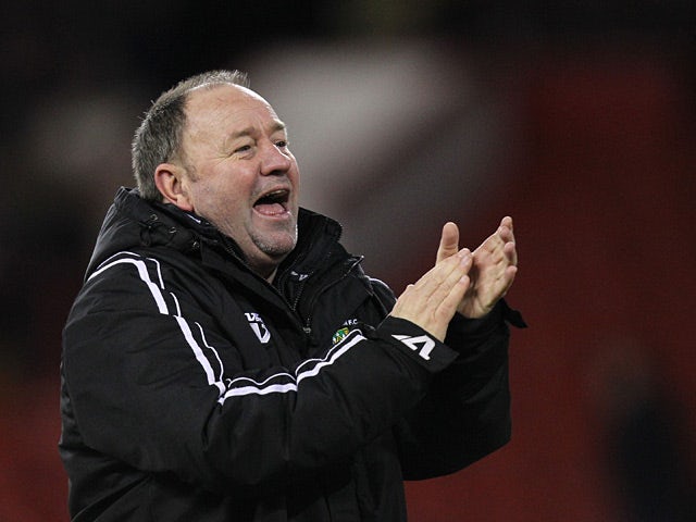 Yeovil Town manager Gary Johnson salutes fans after beating Sheffield United on January 12, 2013