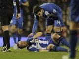 Wigan defender Ivan Ramis lays down injured in the match against Fulham on January 12, 2013