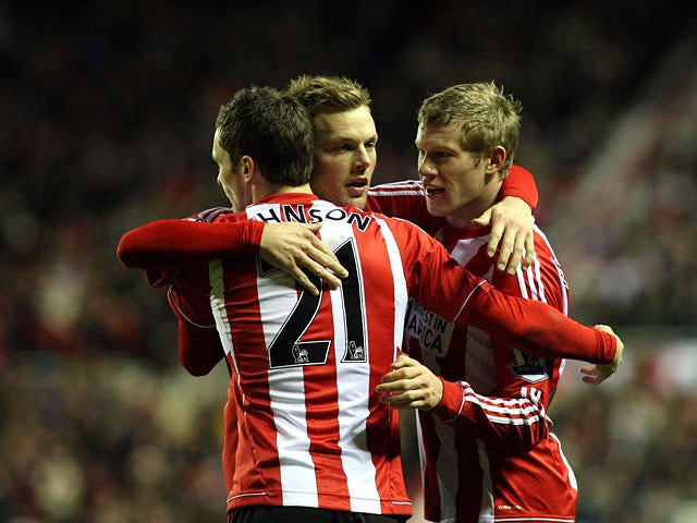 James McClean celebrates with team mates after scoring his team's third goal on January 12, 2013