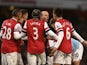 Arsenal players surround referee Mike Dean following the sending off of Laurent Koscielny against Man City on January 13, 2013