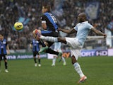 Michael Ciani of Lazio and Atalanta's German Denis battle for the ball in their Serie A clash on January 13, 2013