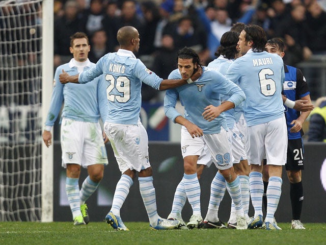 Lazio forward Sergio Floccari celebrates with teammates after scoring in his sides Serie A match with Atalanta on January 13, 2013