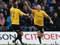 Port Vale's Lee Hughes is congratulated by team mate Tom Pope after scoring his team's second goal against Gillingham on January 12, 2013